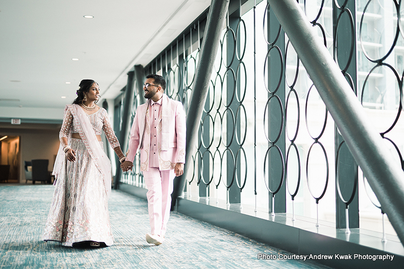 Indian wedding couple walking together to capture a cherished photo