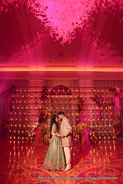 Indian wedding couple at decorated banquet hall